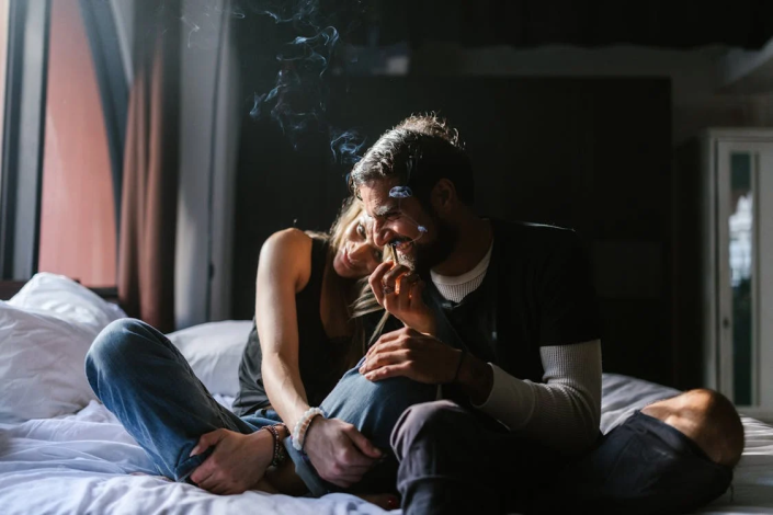 A Couple Smoking A Joint A Couple Smoking A Joint
