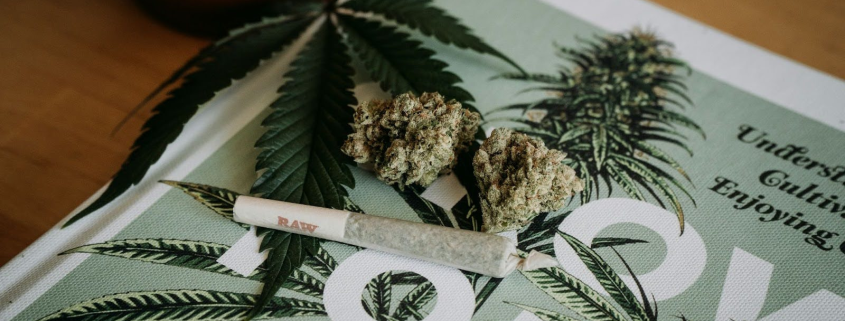 Cannabis Flower, Hemp, And A Pre-Roll On A Table