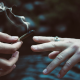 Friends passing a joint to one another