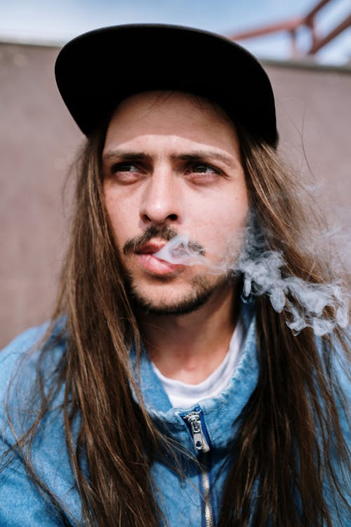 Man Smoking THCa Flower