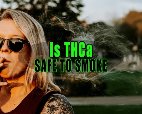 Woman wearing sunglasses smoking a THCa joint.