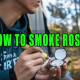 Man using dipping device to smoke rosin