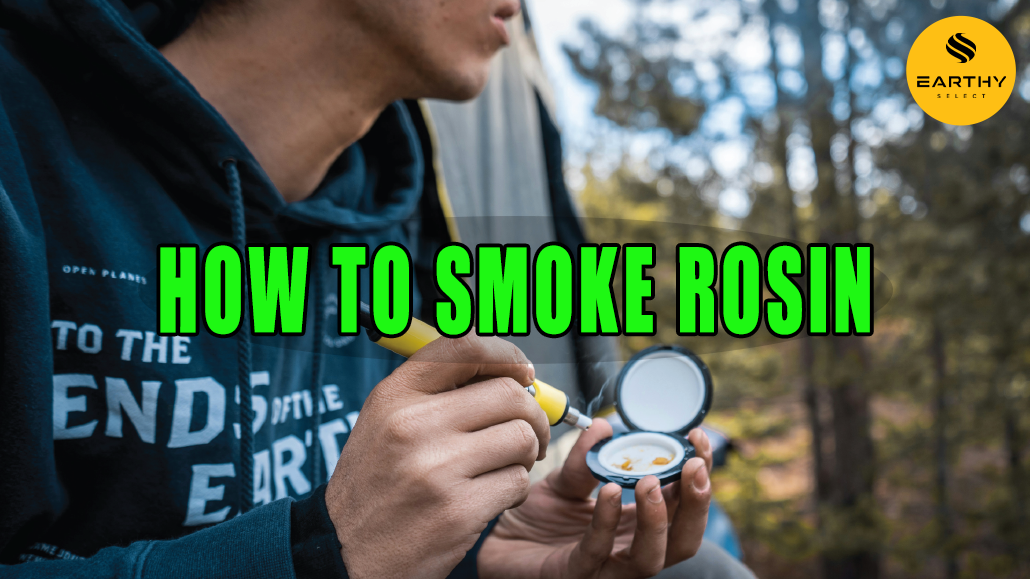 Man using dipping device to smoke rosin