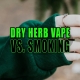 Woman wearing rings and a forest green sweater smoking a joint