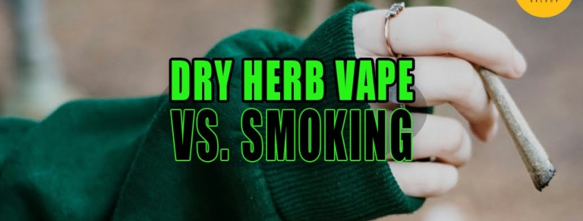 Woman wearing rings and a forest green sweater smoking a joint